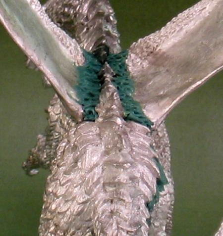 Sculpted scales on the spine of 'Deathsleet'