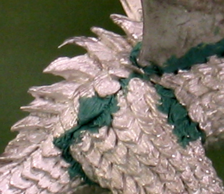 Sculpted scales on the thigh of 'Deathsleet'